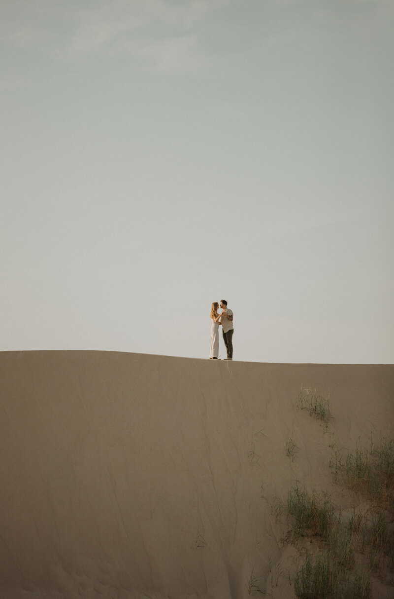 Couple kissing in the desert