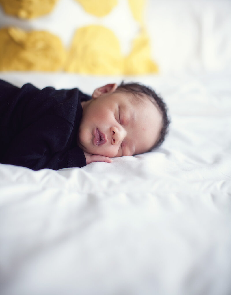 Color image of newborn on the bed