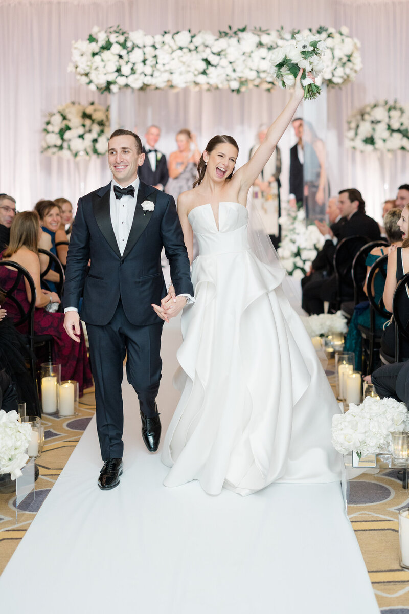Bride and groom walking hand in hand