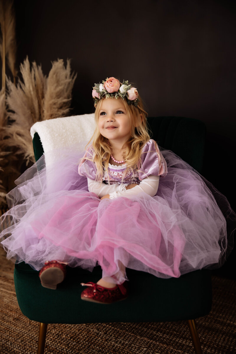 Little girl in a princess dress with flower crown