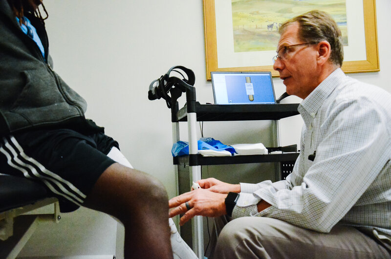 Certified Prosthetist-Orthotist Tracy Duce in consultation with a patient