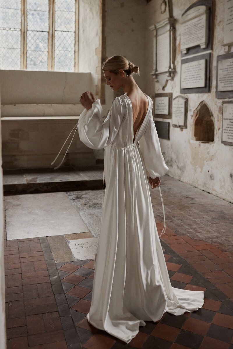 Drawstring silk wedding dress, modern elegant bridal gown style on bride in church