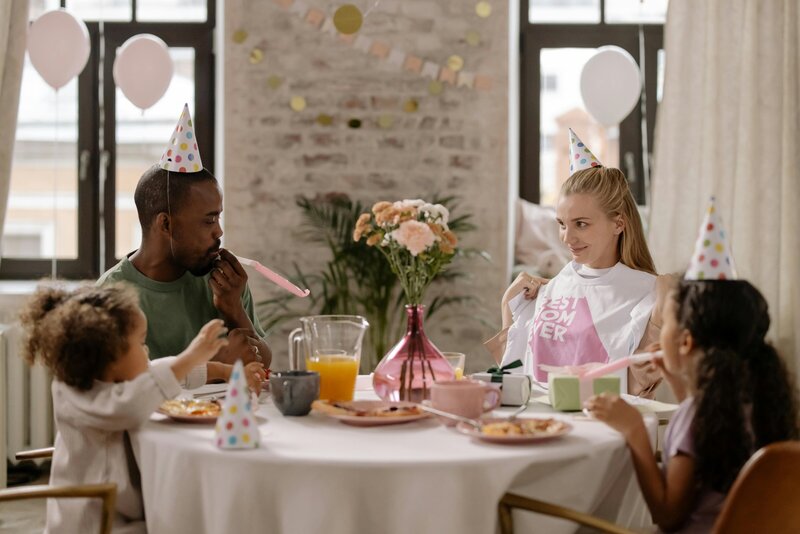 Parents and children enjoying a birthday party in the café space
