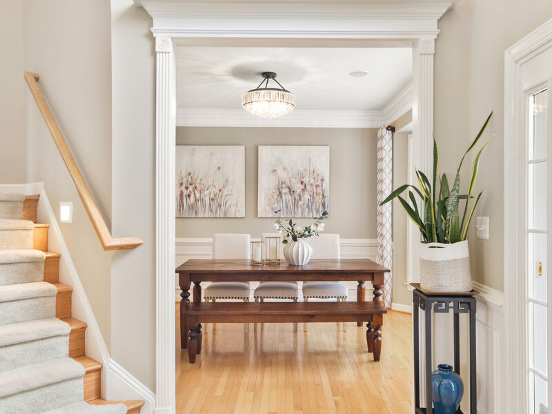 Dining room with flower art on wall