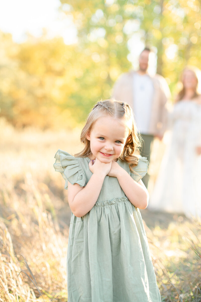 Golden hour family portrait session in Utah, showcasing a stunning family moment, by kamee-valdez-photo