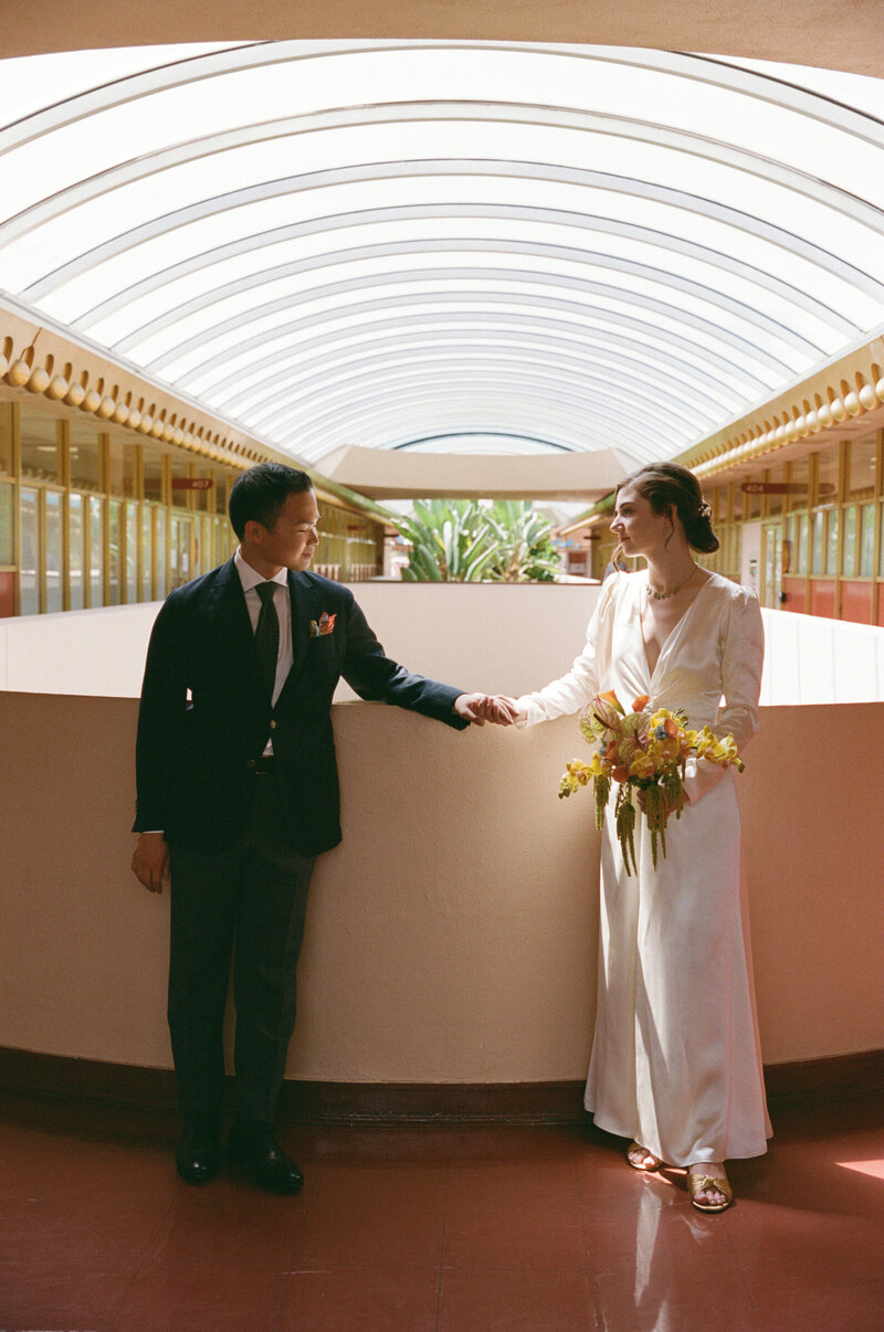 Chic couple pose for engagement portraits at Griffith Observatory