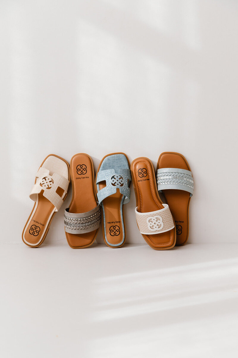 a line up of daisy fuentes shoes on a white backdrop