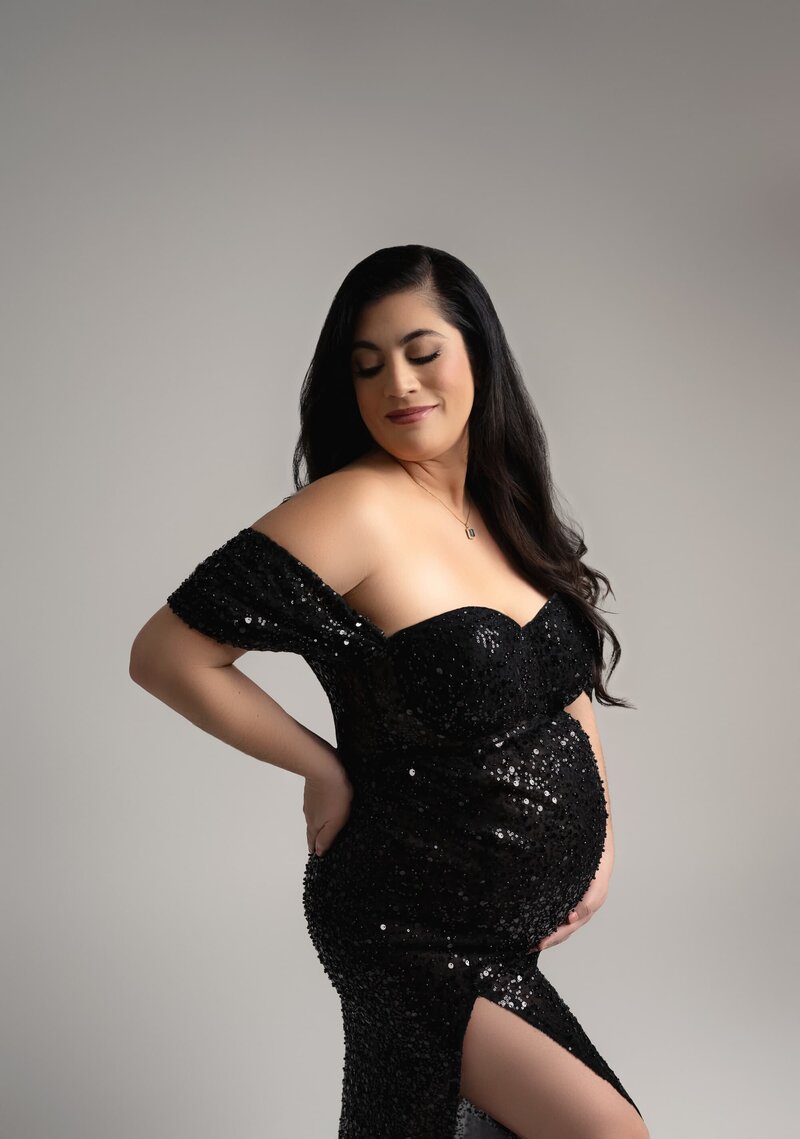 Sparkling sequin dress with off-shoulder neckline and thigh-high slit

