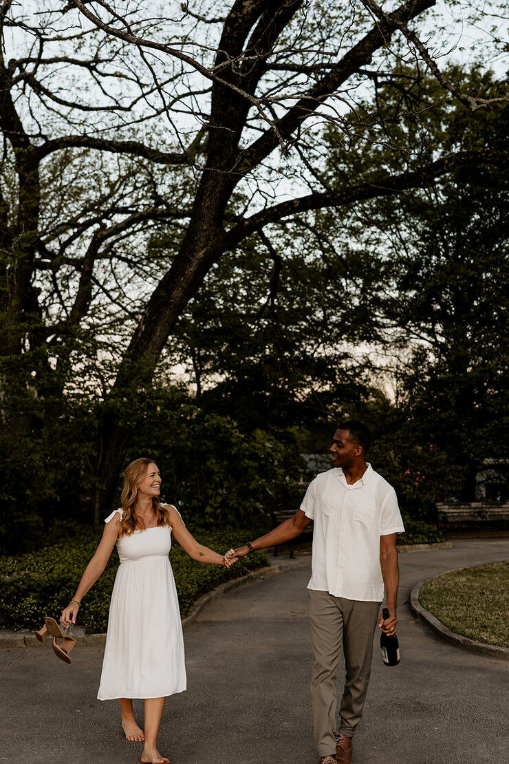 Experience the romance of Isaac & Taylor's engagement session in Atlanta. Captured in a narrow alleyway, these intimate and candid photos showcase the couple's deep connection. Perfect inspiration for urban engagement photography.