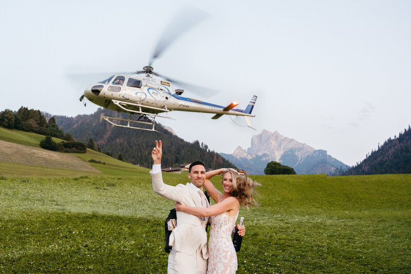 Couple eloping in the Dolomites with a helicopter