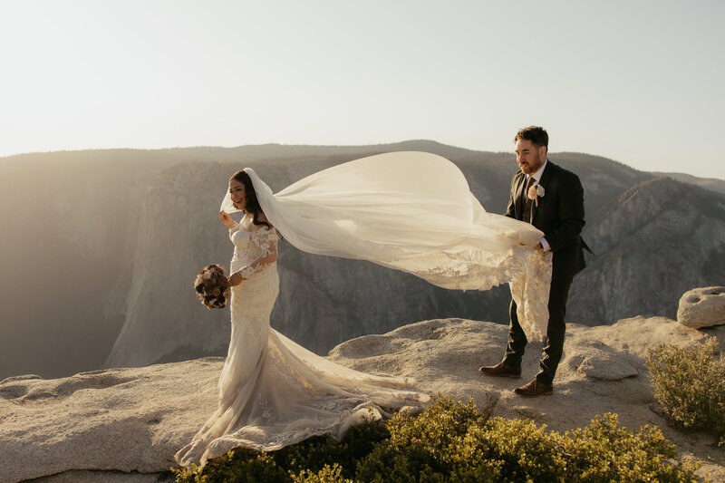 Bride and groom at taft point in yosemite for their elopement