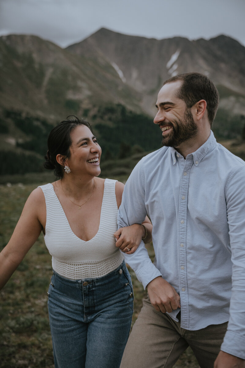 A couple takes their engagement photos on Loveland Pass during the summer in Colorado.