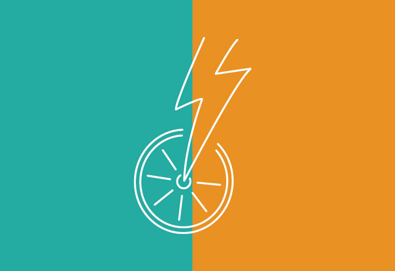 The Gorge E-Bike Adventure Rentals white logo mark made up of lightning bolt that doubles as the front of a bike frame, half circle that is the inside ring of a tire doubling as the sun, and tire spokes doubling as sun rays on a blue and orange background