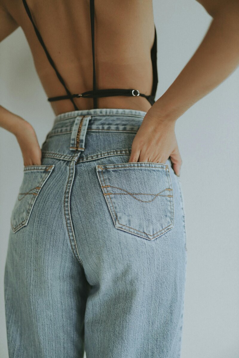 Shot of woman's jeans from behind with hand in pocket