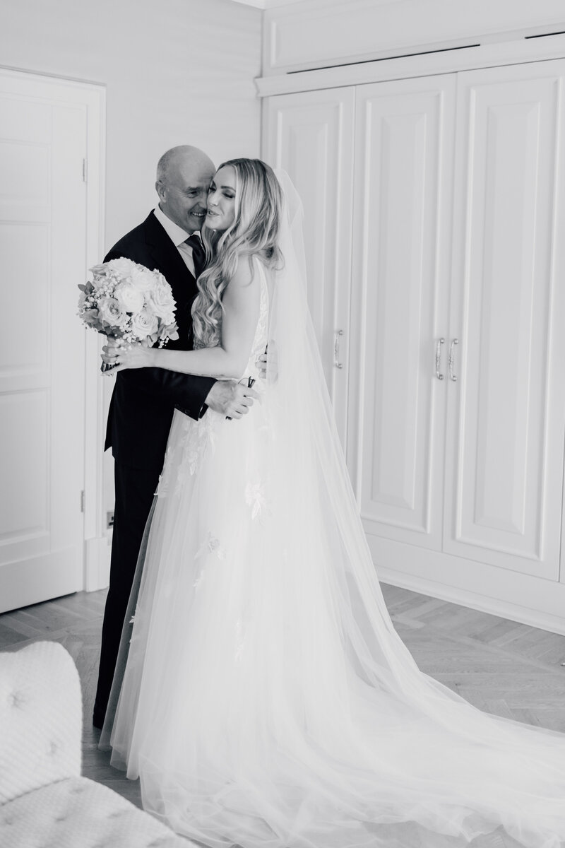 bride-embracing-dad-first-look