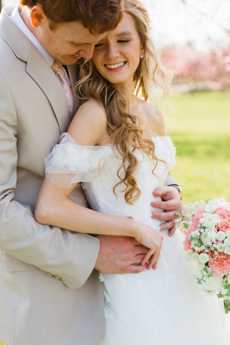 bride and groom embracing