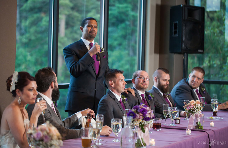 Best man speech in front of windows on lower level of Pines at Genesee