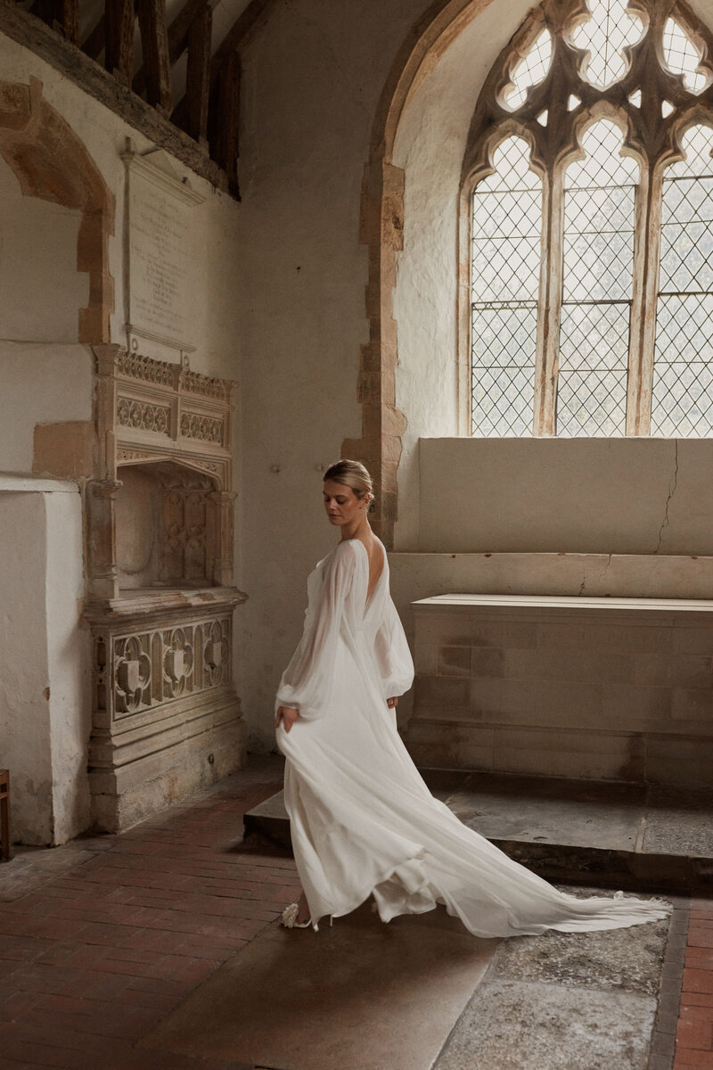 Flowing silk wedding dress with deep v neck back design by Luna Bea, British Bridal Designer