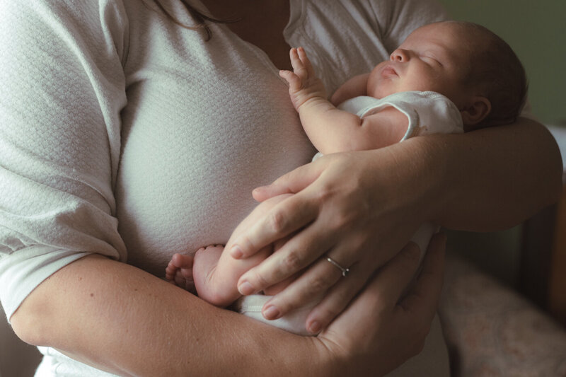 mother holding newborn baby