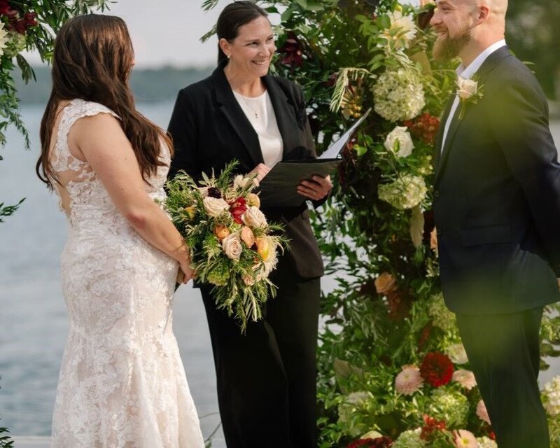 Reverend Sarah Harrison guides bride and groom through their wedding ceremony