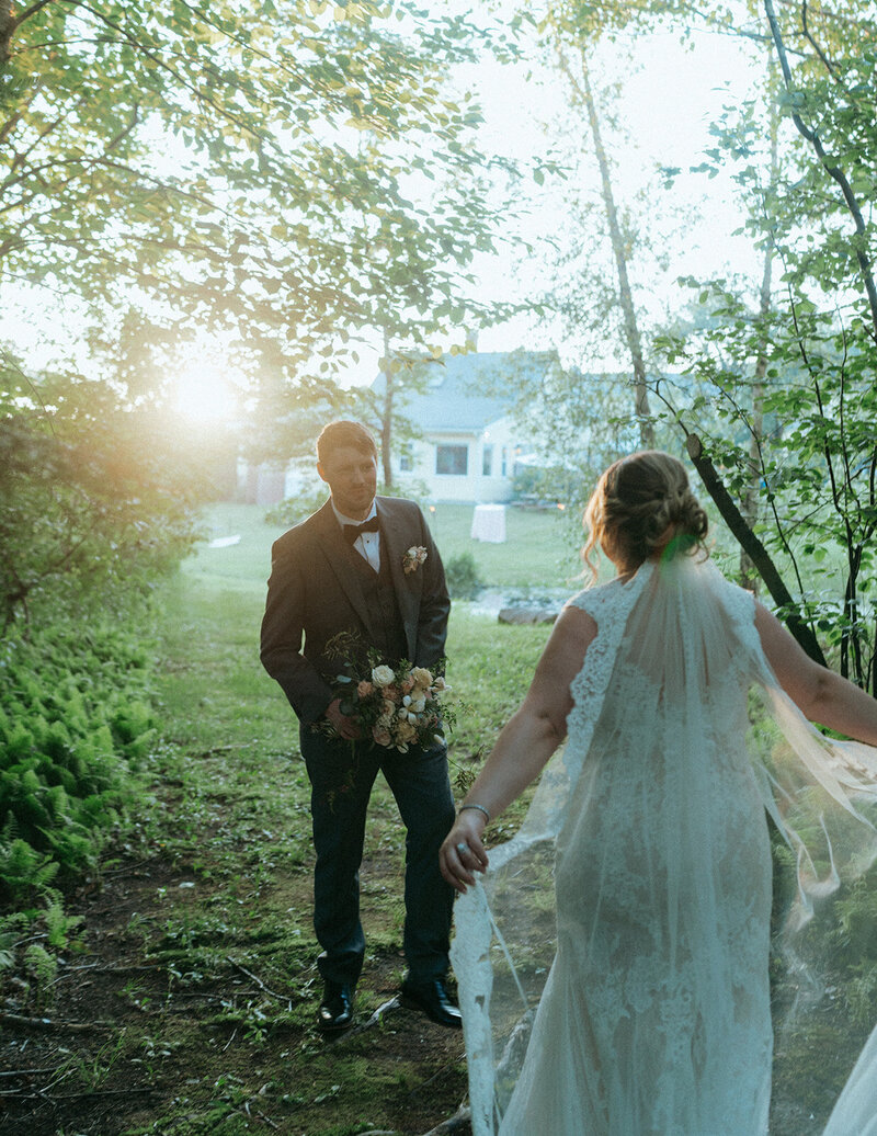 bride and groom first look captured by vermont wedding photographer elsie goodman