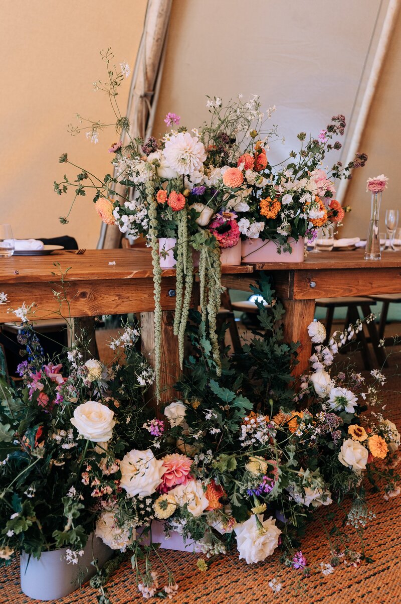 a floral installation in multicolour in an element tipi at a christchurch wedding