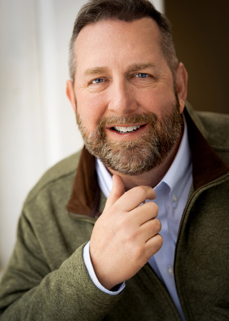 Scott Shaw wearing a green jacket.