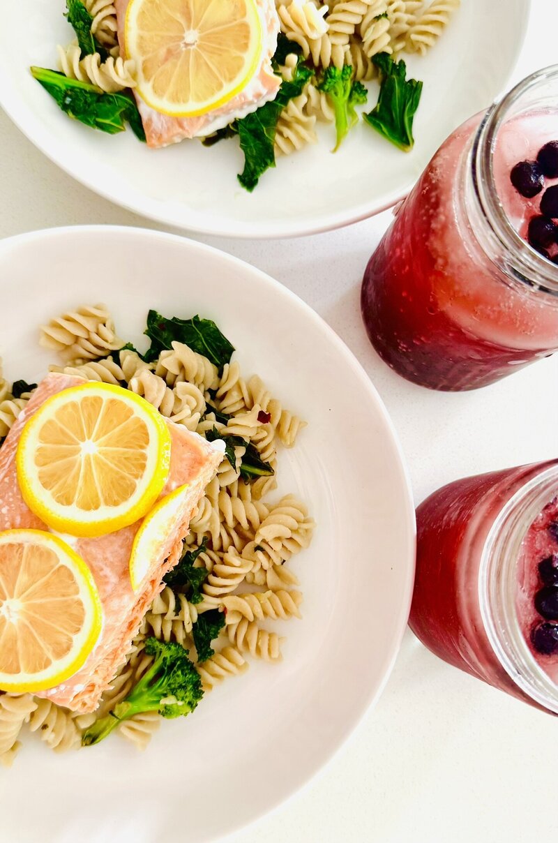 salmon drizzled with lemon, and brown rice (gluten-free) pasta with kale and red pepper flakes