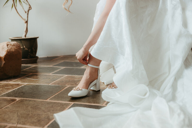 bride-getting-ready-shoes-dress