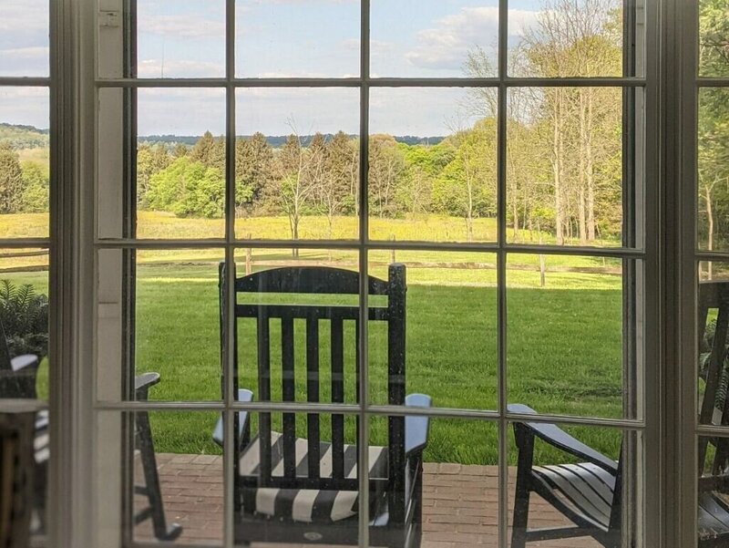 a rocking chair overlooking farm land