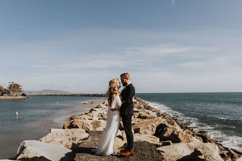Elopement Photographer, bride kisses groom on the cheek at the beach