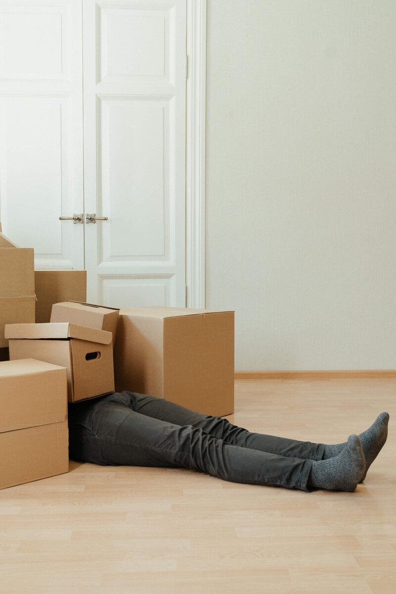 moving boxes person on floor