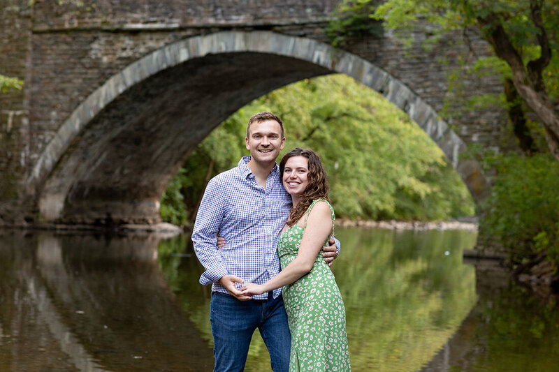 Engaged Couple in the creek at Wissahickon Valley Park in Philadelphia
