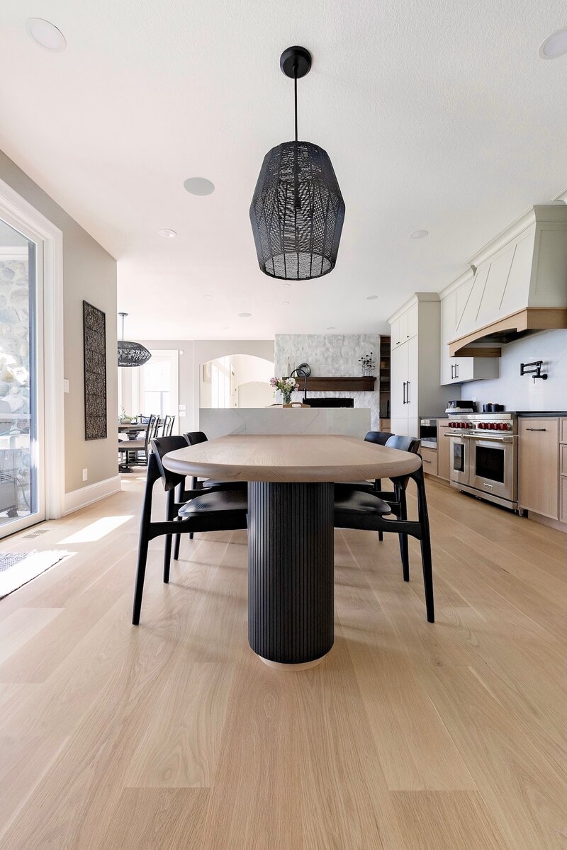 Modern dinning room with a bold dinning room table and sleek black chairs