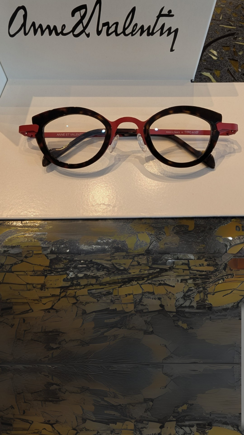 A red tortoise shell pair of Anne and Valentin luxury high end glasses at Colaizzo Opticians in Queen Anne Seattle