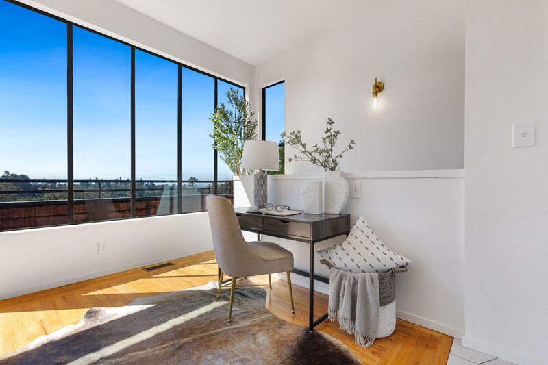 Beautifully staged East Bay hillside home interior with natural light and workspace.
