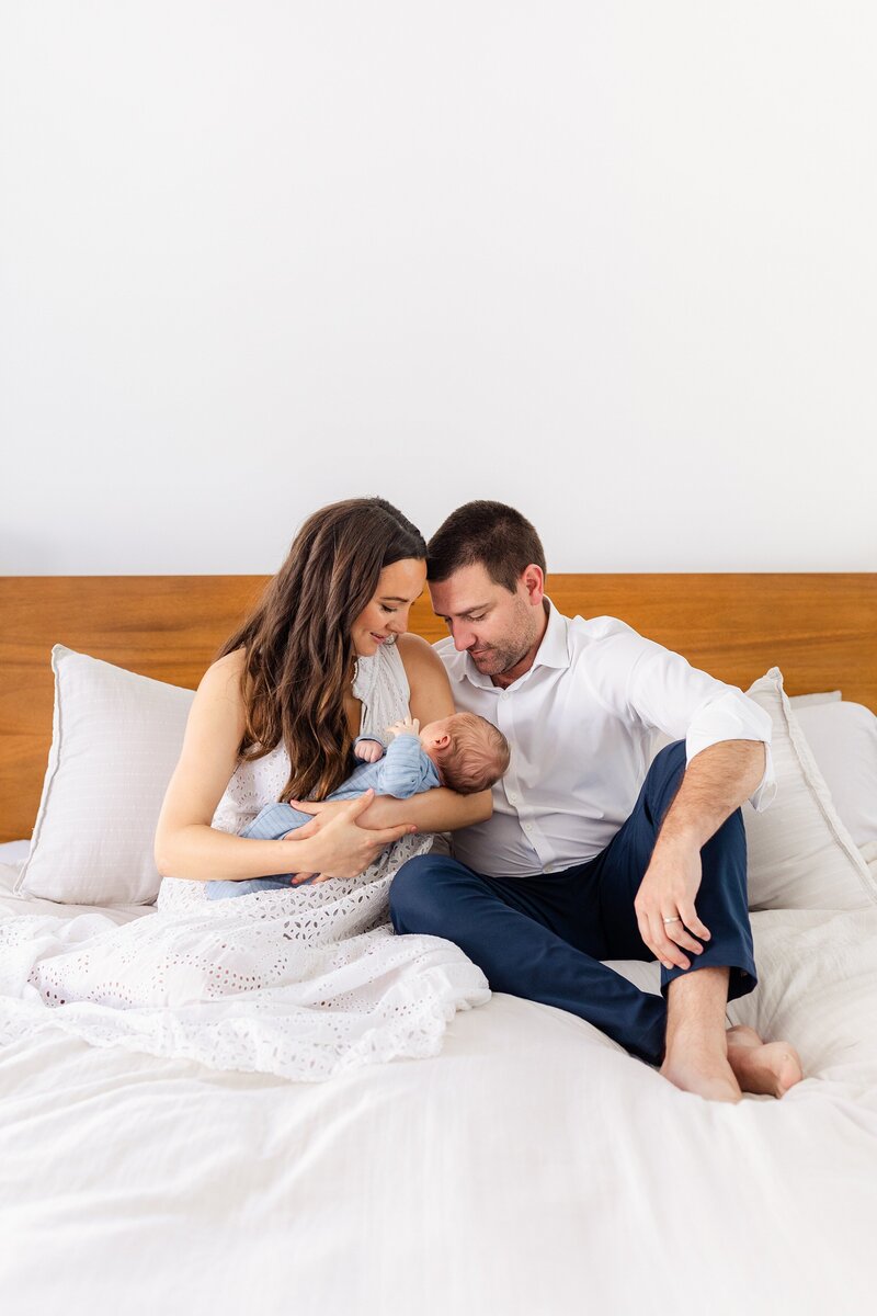 bright and airy natural moment with parents holding their newborn at home in LA