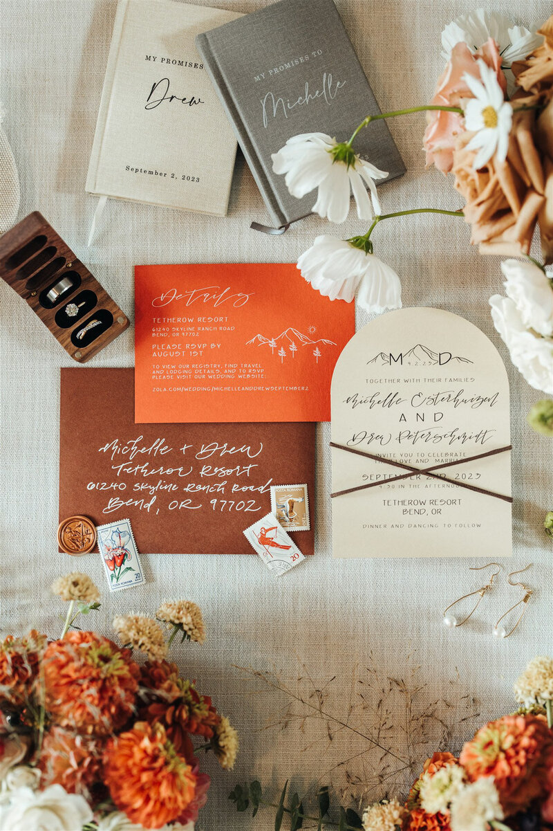Luxury mountain wedding suite with florals, envelope, calligraphy details and stamps representing full service design and calligraphy by Life in Letters.