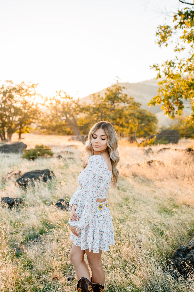 Senior with Boots in a Field | Photography by Jocelyn