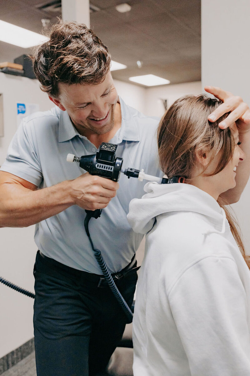 chiropractor helping girl with neck issues