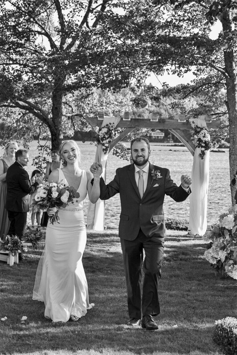 Bride and Groom exiting ceremony | Klein Wedding at Grace on the Lake taken by Maine Wedding Photographer