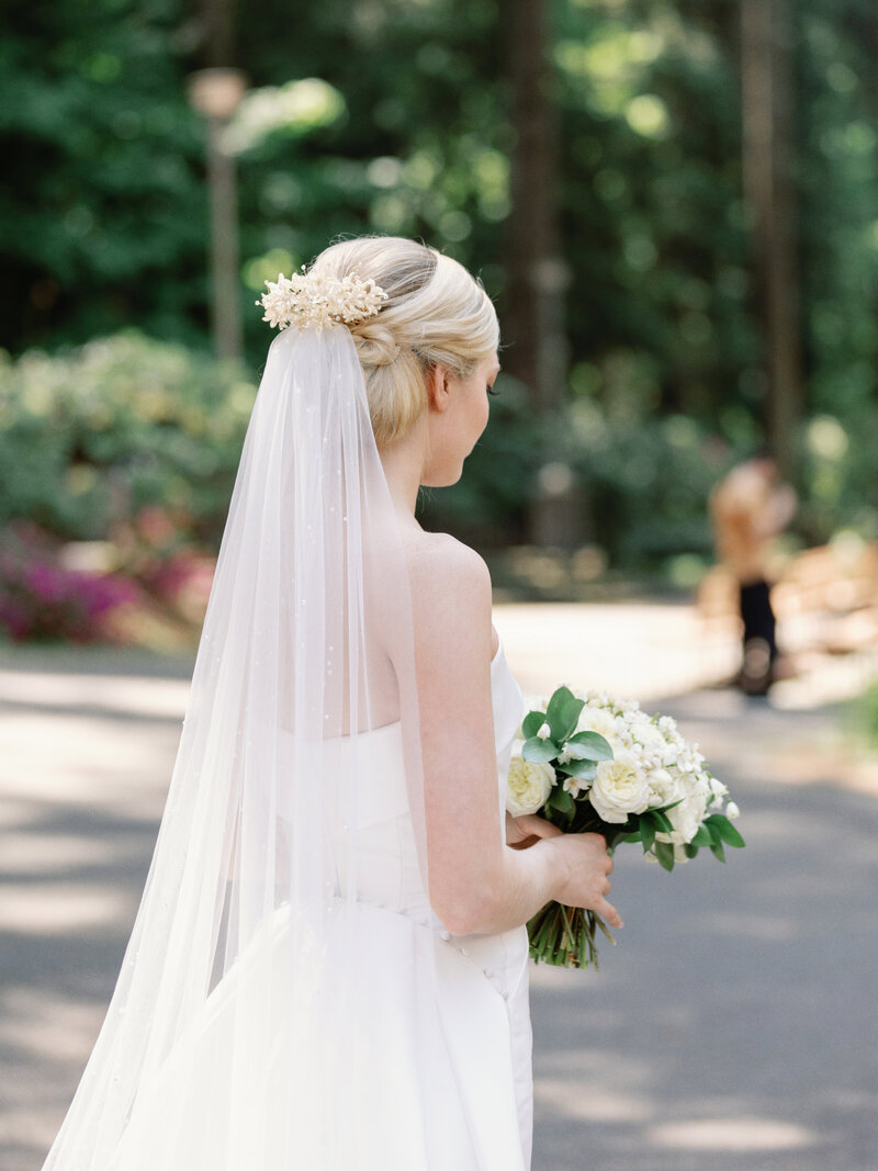 Modern bride wearing her Grandma's 1950's vintage heirloom wax flower bridal crown restyled into a modern hair comb