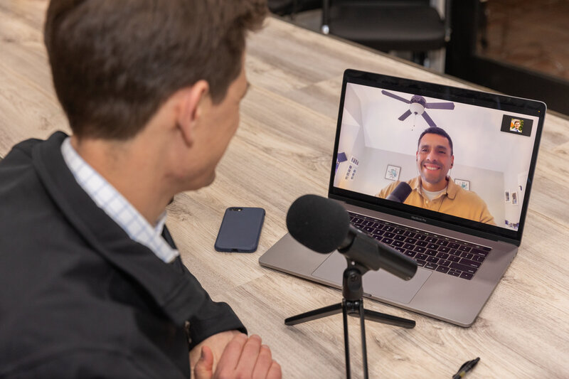 consultant recording a podcast and having a zoom meeting in a conference room Atlanta Brand Photographer