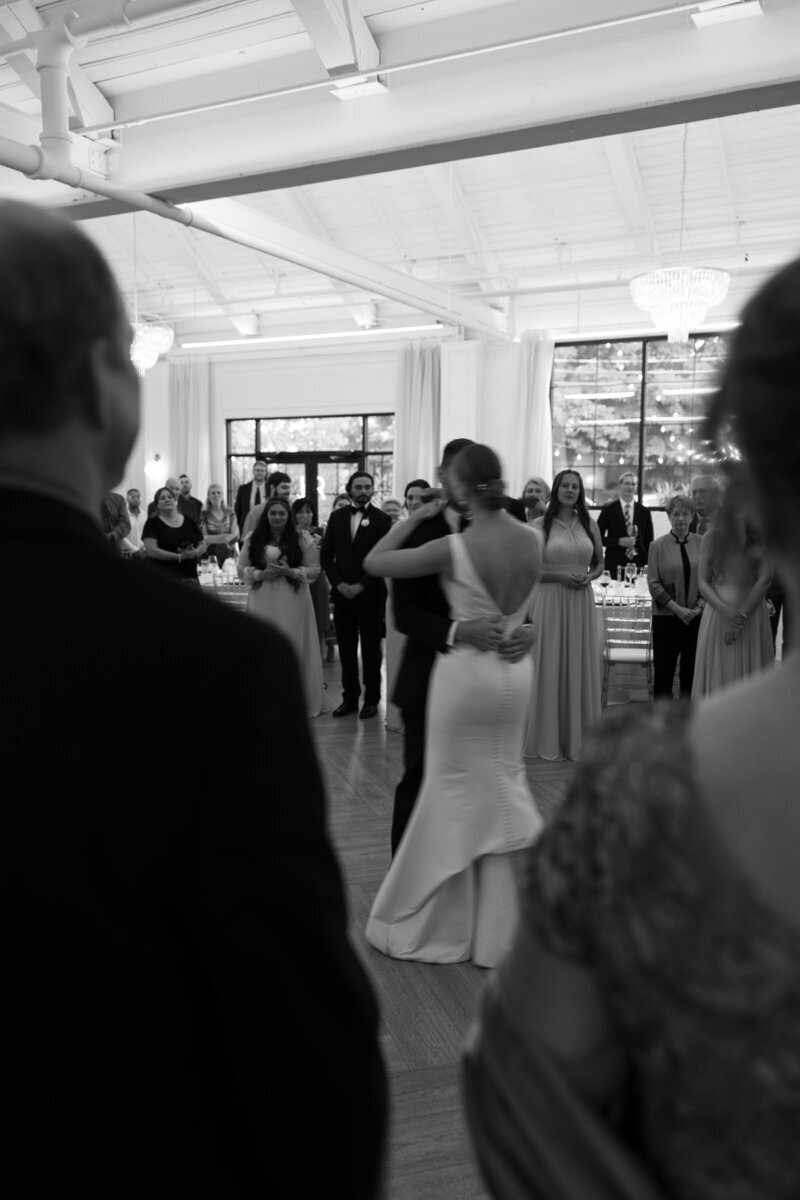 Bride and groom dancing by film wedding photographer Noble Photo Co