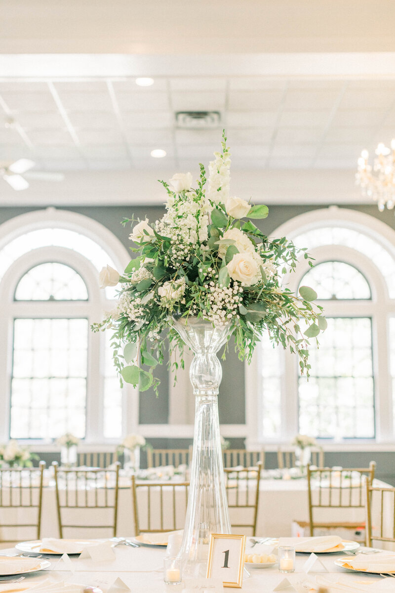 white and green wedding reception florals