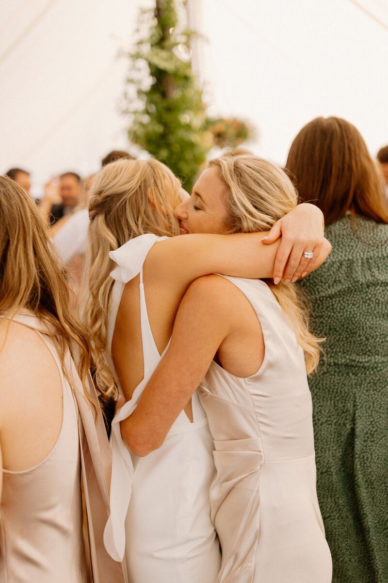 Bridesmaids in light blue dresses running together