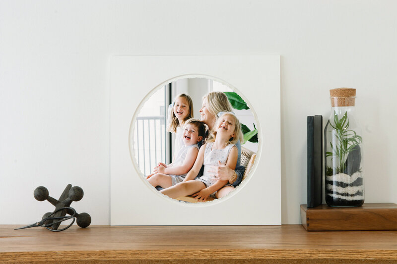 deckled edge print of a mom with her three kids