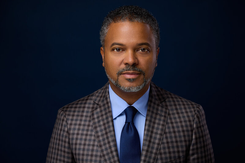 Professional headshot of Dallas entrepreneur in studio