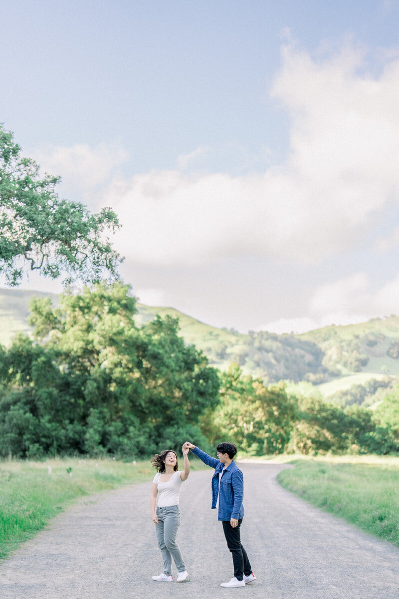A scenic engagement session amidst the lush vineyards of Napa Valley, California, photographed by Tiffany Longeway Photography.