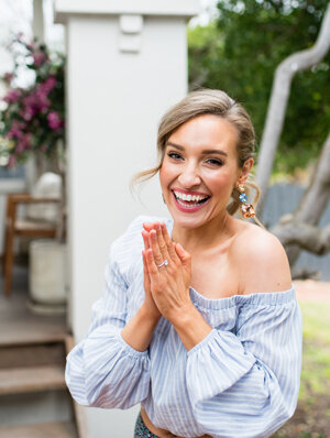 Emily dancing in a floral dress.